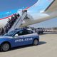Reputed mobster Marc Feren Claude Biart being offloaded from a plane by police.